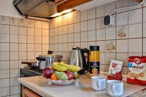 Kuchyň nebo kuchyňský kout v ubytování Adonis Apartments
