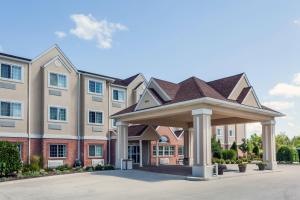 a large building with a gazebo in front of it at Microtel Inn & Suites by Wyndham Michigan City in Michigan City