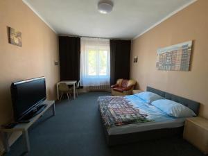 Posteľ alebo postele v izbe v ubytovaní Bon Voyage Apartments