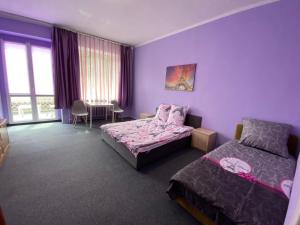 Posteľ alebo postele v izbe v ubytovaní Bon Voyage Apartments