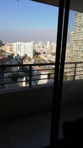 a view of a city skyline from a balcony at Apartamento Metro Santa Lucia, Santiago Centro in Santiago