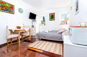 TV a/nebo společenská místnost v ubytování Rooms Daria