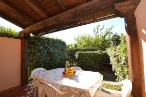 a table with a banana on it on a patio at Appartamenti Airone in San Teodoro