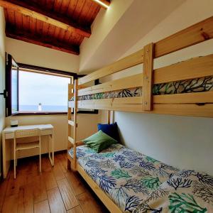 A bed or beds in a room at Terrazza del Golfo