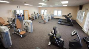 a gym with several treadmills and exercise bikes at The Terrace Hotel at Lake Junaluska in Lake Junaluska