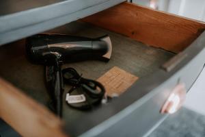 a hair dryer sitting on top of a drawer at The Royal Oak in Heckington