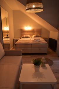 Postel nebo postele na pokoji v ubytování Rewianka Apartamenty przy samej plaży