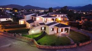 an aerial view of a house at night at Appartamenti Corallo in San Teodoro