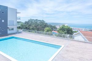 a swimming pool on the balcony of a house at Apartamento T2 Tin Tin in Nazaré