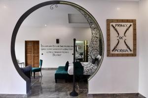 a mirror in the middle of a room at Oscar Hotel by Atlas Studios in Ouarzazate