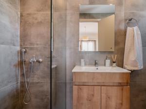 a bathroom with a sink and a shower at Sunset Apartments in Tsilivi