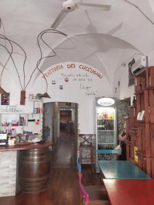 a restaurant with a sign on the wall at traivicolidifoligno in Foligno