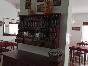 a bar with a bunch of bottles on the wall at Hotel Danubio in Bellaria-Igea Marina