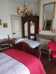 Кровать или кровати в номере B & B Les Secrets des Loges