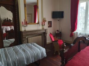 Кровать или кровати в номере B & B Les Secrets des Loges