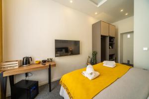 Ein Bett oder Betten in einem Zimmer der Unterkunft Elenas Rooms & Apartment
