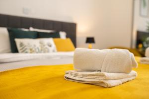 Ein Bett oder Betten in einem Zimmer der Unterkunft Elenas Rooms & Apartment