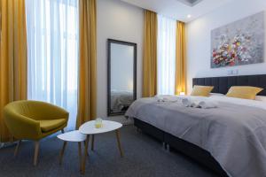Ein Bett oder Betten in einem Zimmer der Unterkunft Elenas Rooms & Apartment
