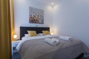 Ein Bett oder Betten in einem Zimmer der Unterkunft Elenas Rooms & Apartment