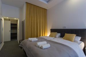 Ein Bett oder Betten in einem Zimmer der Unterkunft Elenas Rooms & Apartment