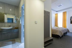 Ein Bett oder Betten in einem Zimmer der Unterkunft Elenas Rooms & Apartment