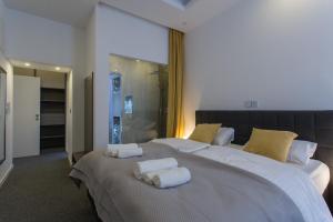 Ein Bett oder Betten in einem Zimmer der Unterkunft Elenas Rooms & Apartment