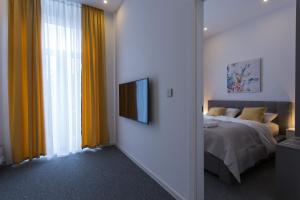 Ein Bett oder Betten in einem Zimmer der Unterkunft Elenas Rooms & Apartment