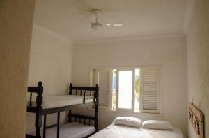 Bunk bed o mga bunk bed sa kuwarto sa Hostel Da Duda
