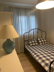Postel nebo postele na pokoji v ubytování Domki i Apartamenty El-Piero