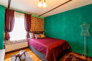 A bed or beds in a room at Art apartment EVMOLPIAS near Roman stadium