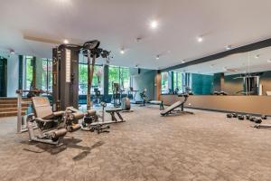a gym with several treadmills and exercise equipment at 504 Premium Nadmorskie Tarasy przy Latarni i Molo pool sauna fitness garage FREE in Kołobrzeg