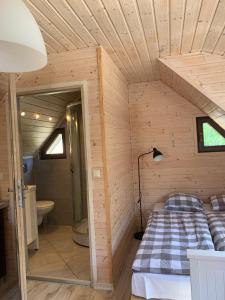 Postel nebo postele na pokoji v ubytování Domki i Apartamenty El-Piero