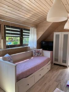 Postel nebo postele na pokoji v ubytování Domki i Apartamenty El-Piero