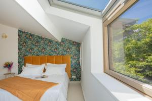 Een bed of bedden in een kamer bij Hôtel & Résidence San Roccu