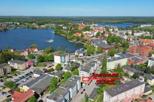 an aerial view of a city with a river at Apartament SHARK w centrum z klimą in Iława