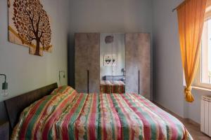 En eller flere senger på et rom på Appartamento Fronte Mare - parcheggio privato