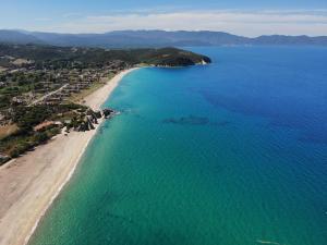 an aerial view of a beach and the ocean at Dionysus Apartments & Suites in Ierissos