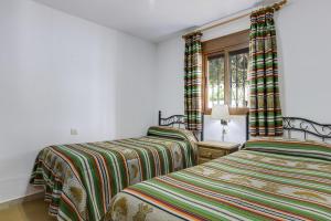 Posteľ alebo postele v izbe v ubytovaní Casa Miguelin