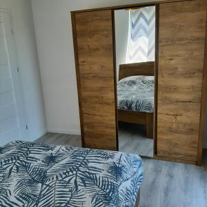 Postel nebo postele na pokoji v ubytování Apartament Thomas