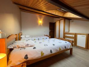 Postel nebo postele na pokoji v ubytování Le Gîte De Babeth