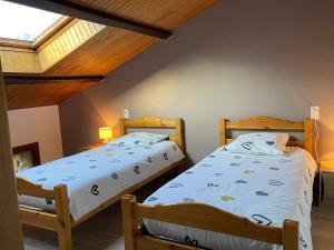 Postel nebo postele na pokoji v ubytování Le Gîte De Babeth