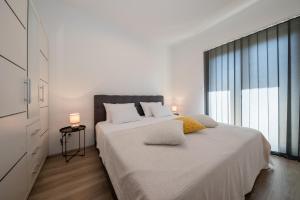 Łóżko lub łóżka w pokoju w obiekcie Apartments Sole