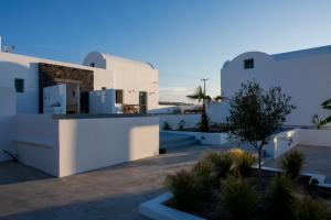 a view of a villa with white buildings at Oia Kissiri - Private Pool Villas in Oia