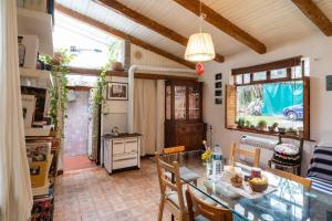 a kitchen and dining room with a table and chairs at Granducato di Monteballante in Pesaro