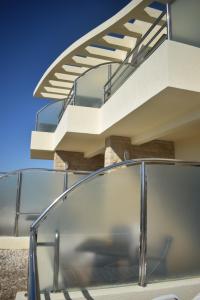 a modern house with a glass stair railing at Auberge Oualidia Dream in Oualidia
