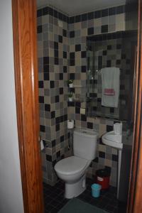 a bathroom with a toilet and a sink at Auberge Oualidia Dream in Oualidia +37 photos