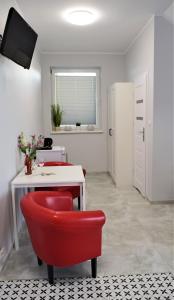 TV a/nebo společenská místnost v ubytování Rewianka Apartamenty przy samej plaży
