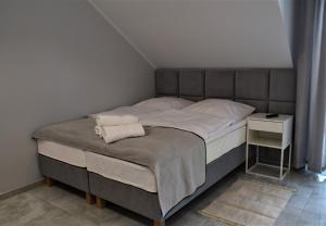 Postel nebo postele na pokoji v ubytování Rewianka Apartamenty przy samej plaży