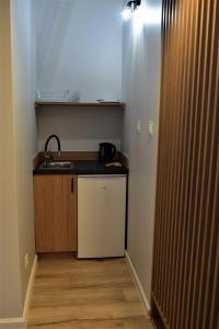 Kuchyň nebo kuchyňský kout v ubytování Rewianka Apartamenty przy samej plaży