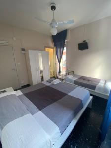 Posteľ alebo postele v izbe v ubytovaní Hotel La Pergola